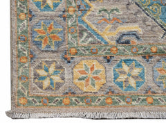 A handwoven Afghan Chobi runner featuring a geometric floral pattern in muted earth tones.
