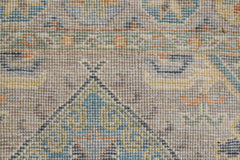 A close-up view of a handwoven Afghan Chobi runner featuring intricate geometric patterns.