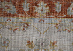 A close-up of an Afghan Chobi runner featuring traditional floral patterns in earthy tones.