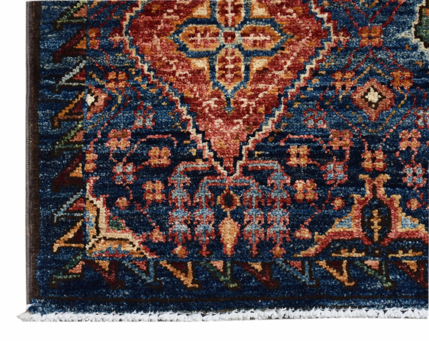 A close-up of an Afghan Chobi runner featuring a traditional blue, red, and cream floral pattern.