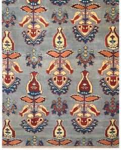 Handmade Afghan Chobi runner featuring a repeating floral motif in red, yellow, and blue on grey.