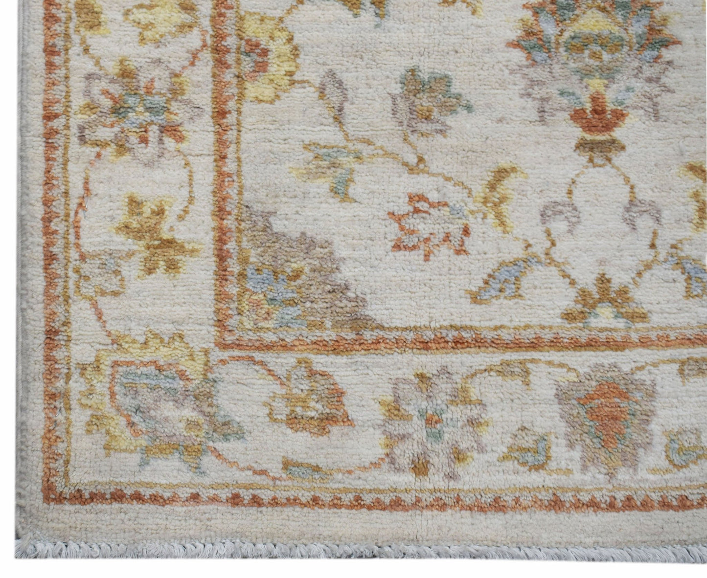 A handmade Afghan Chobi runner featuring a traditional floral pattern in soft, earthy tones.