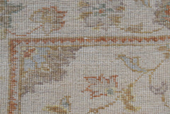 A close-up of a handwoven Afghan Chobi runner featuring traditional patterns in earthy tones.