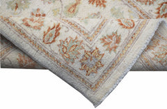 A handwoven Afghan Chobi runner featuring traditional floral patterns in soft earth tones.