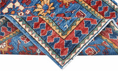 A hand-knotted Afghan Chobi runner featuring a traditional floral pattern in blue, red, and gold.