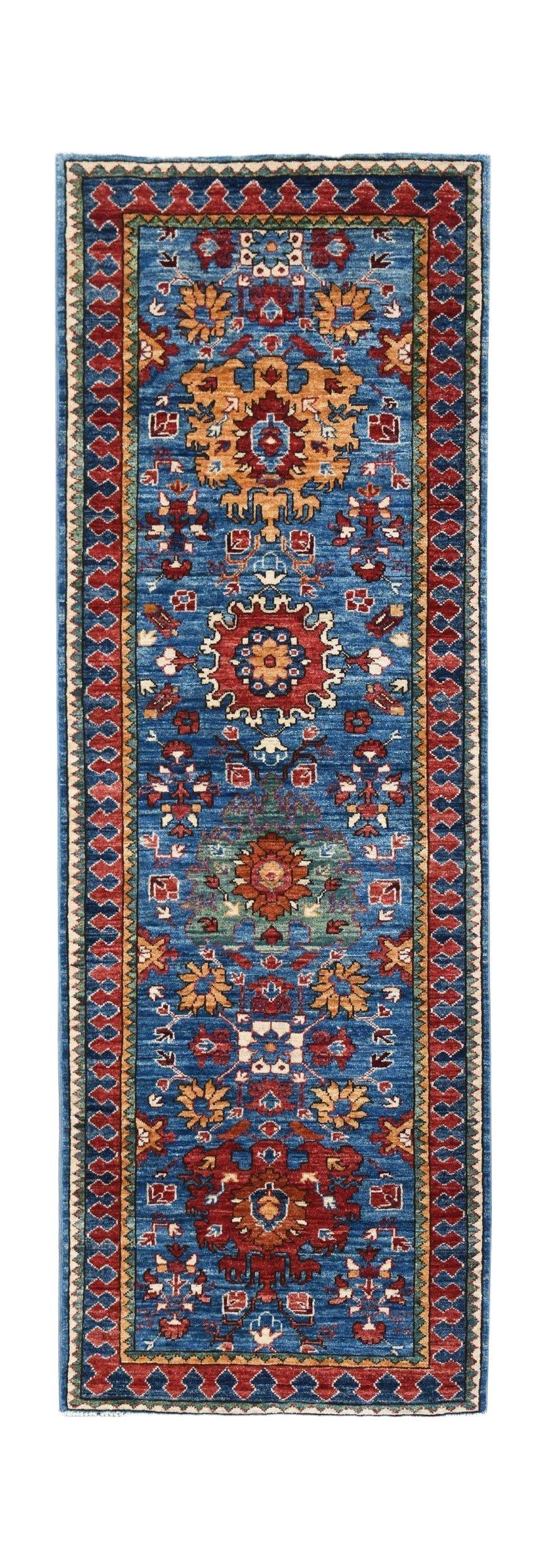 A handmade Afghan Chobi runner rug featuring traditional floral patterns in blue, red, and gold.