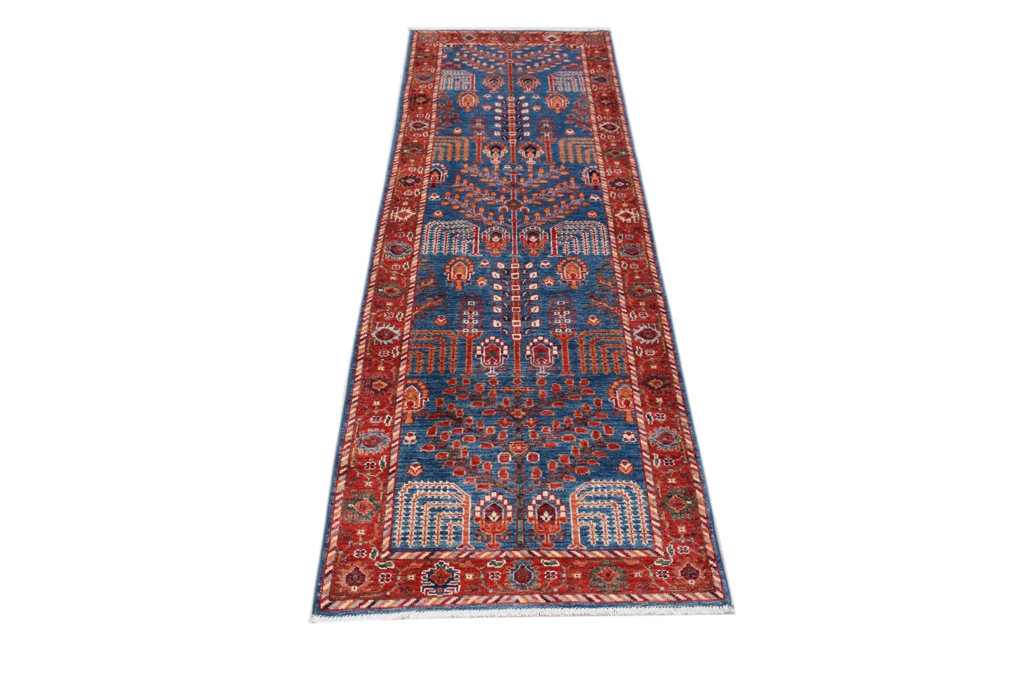 An Afghan Chobi runner rug featuring a traditional blue field with intricate red floral patterns.