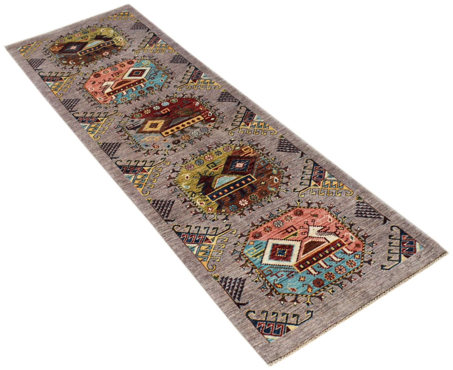 An Afghan Chobi runner rug featuring a series of geometric medallions on a grey wool background.