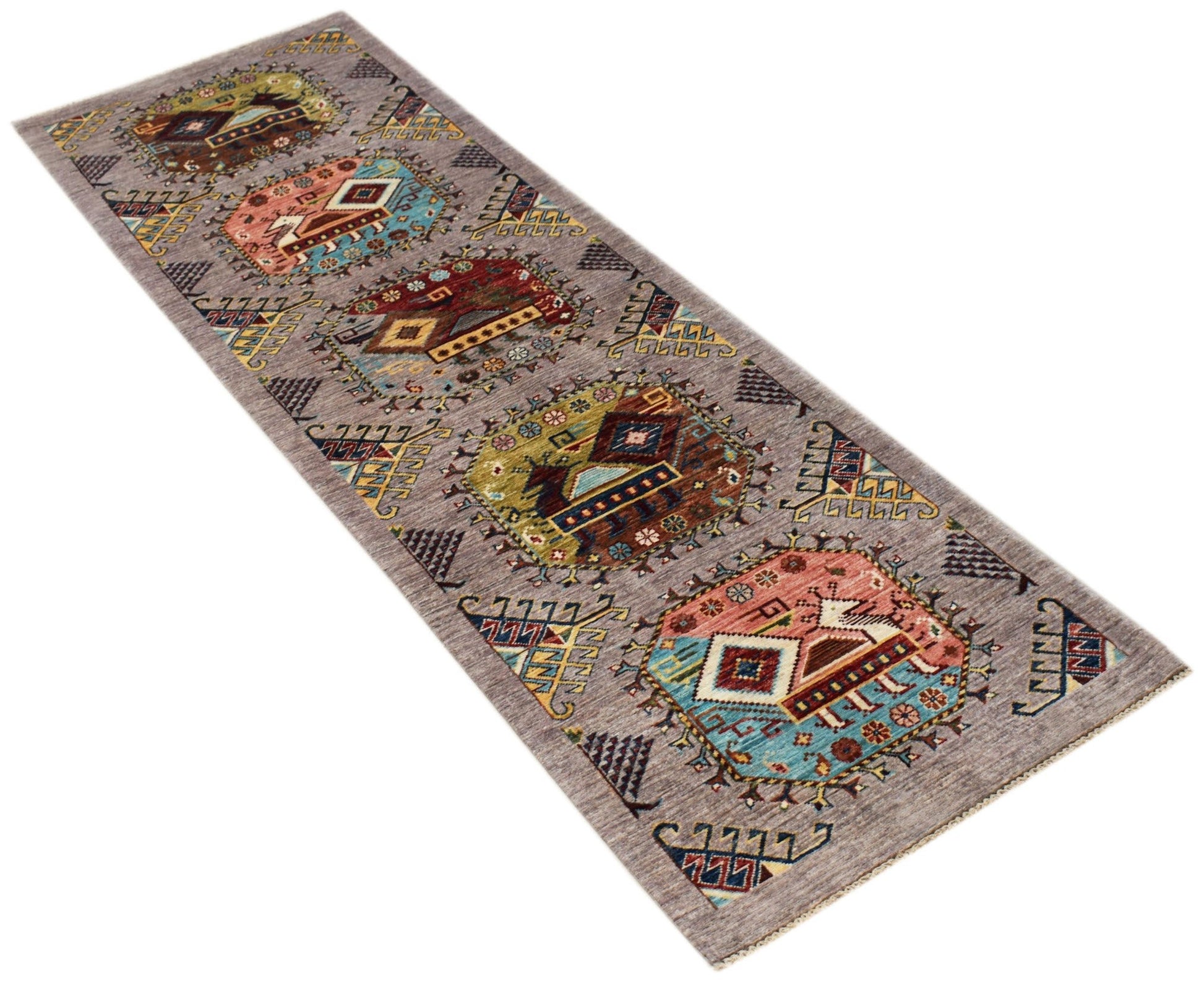 An Afghan Chobi runner rug featuring a series of geometric medallions on a grey wool background.