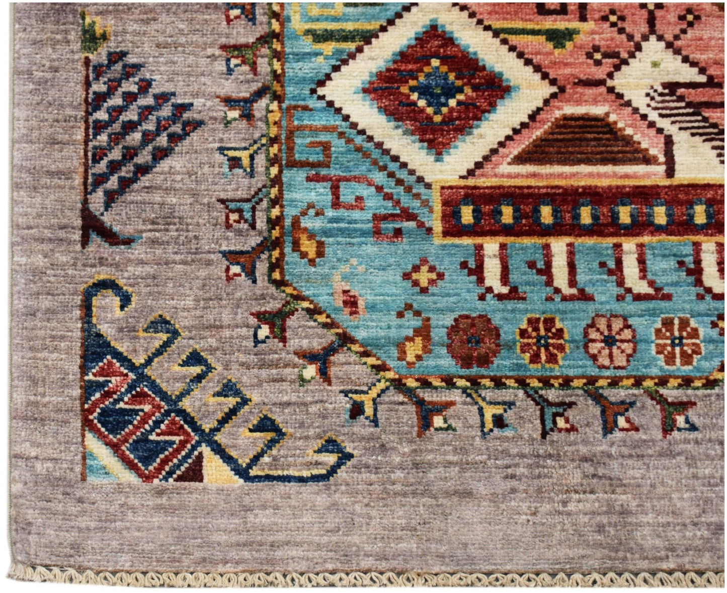 A hand-knotted Afghan Chobi runner featuring a geometric pattern in blue, red, and earthy tones.
