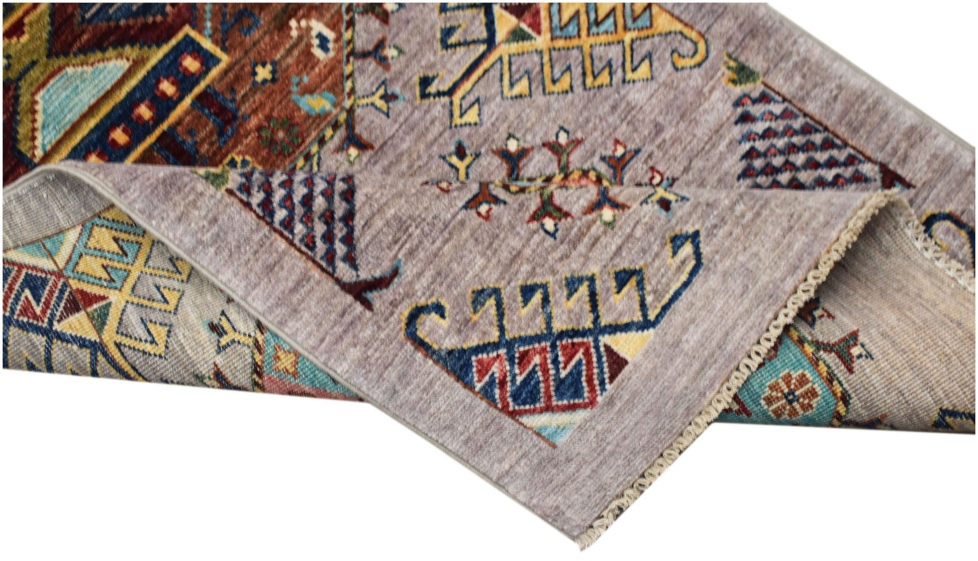 A hand-knotted Afghan Chobi runner featuring traditional geometric patterns in earthy tones.