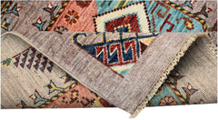 A hand-knotted Afghan Chobi runner featuring traditional geometric patterns in earthy tones.
