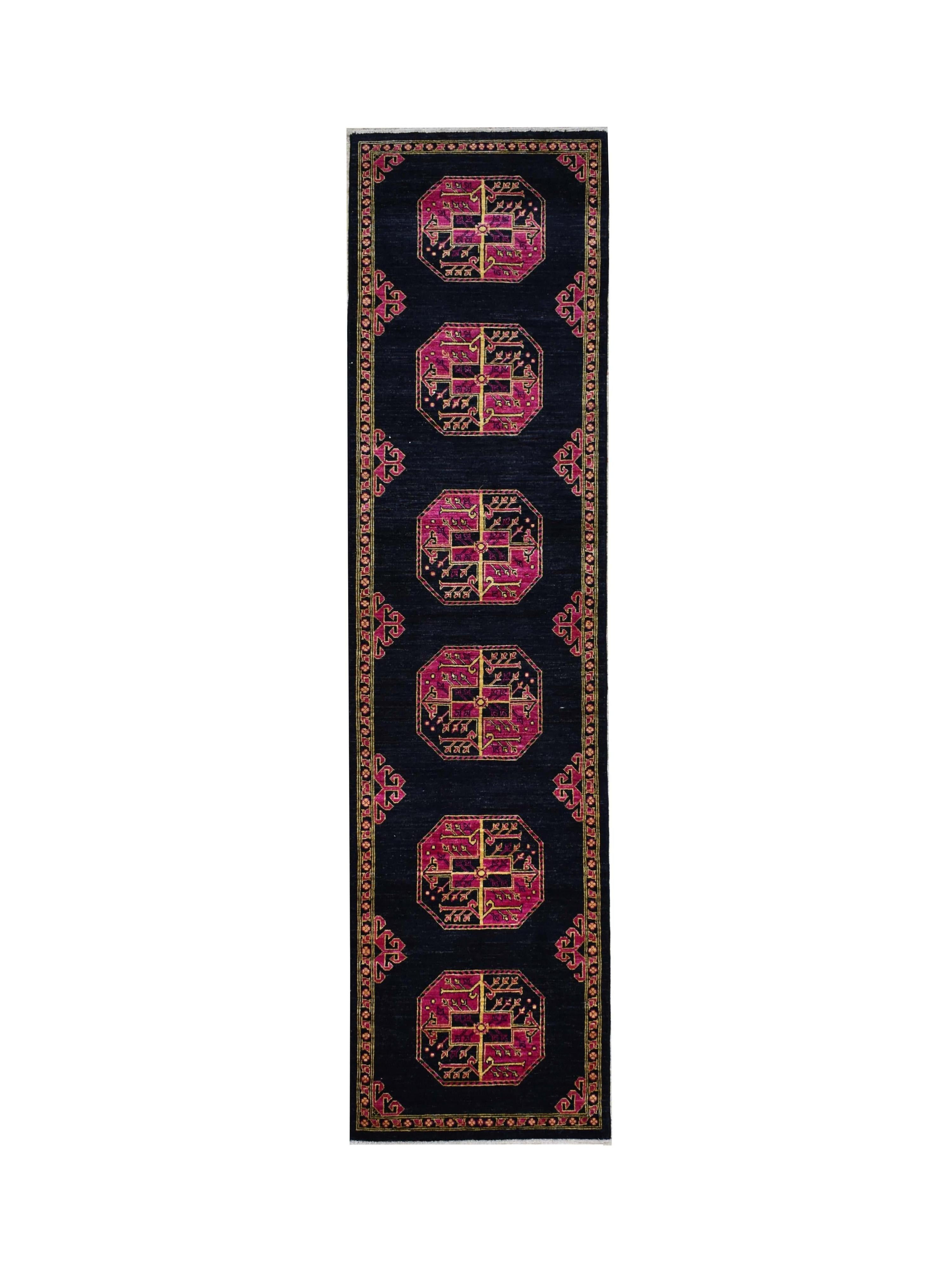 A handmade Afghan Chobi runner featuring six magenta octagonal medallions on a dark navy field.