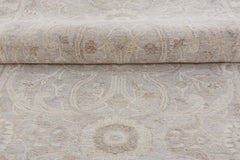 A handmade Afghan Chobi runner featuring a traditional beige and brown floral pattern.
