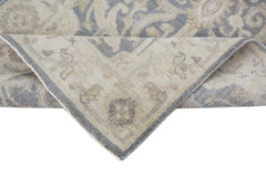 A handmade Afghan Chobi runner featuring a traditional pattern in soft beige and grey tones.