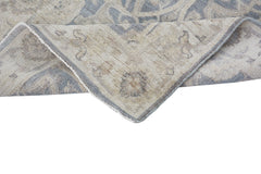 A handmade Afghan Chobi runner featuring a traditional pattern in soft blue and beige tones.