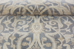 A handmade Afghan Chobi runner featuring a traditional floral pattern in grey and beige wool.