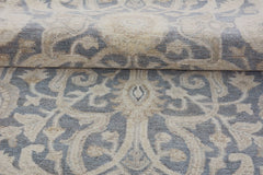 A handmade Afghan Chobi runner featuring a traditional grey and beige floral pattern.