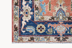 A corner view of a hand-knotted Afghan Chobi runner featuring traditional floral patterns.