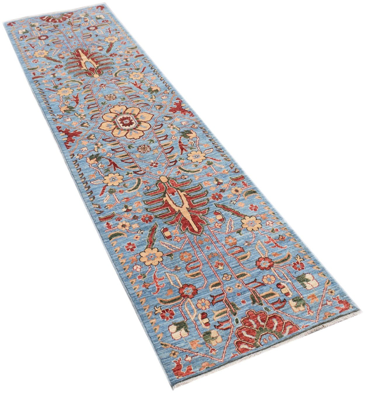 Handmade Afghan Chobi runner rug featuring a traditional floral pattern on a light blue background.