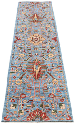 An Afghan Chobi runner rug featuring a traditional floral pattern in red and beige on a blue field.