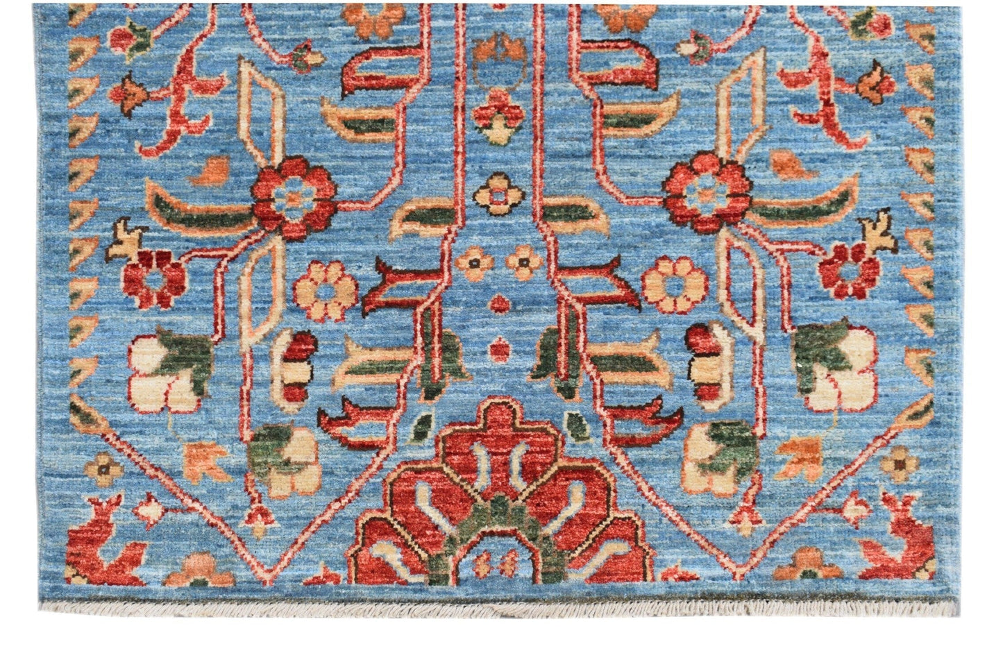 Handmade Afghan Chobi runner featuring a traditional floral pattern in red and blue tones.