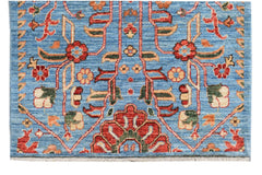 Handmade Afghan Chobi runner featuring a traditional floral pattern in red and blue tones.