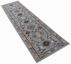 A hand-knotted Afghan Chobi runner rug featuring traditional geometric patterns in blue tones.