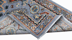 A hand-knotted Afghan Chobi runner featuring traditional floral patterns in blue and orange tones.
