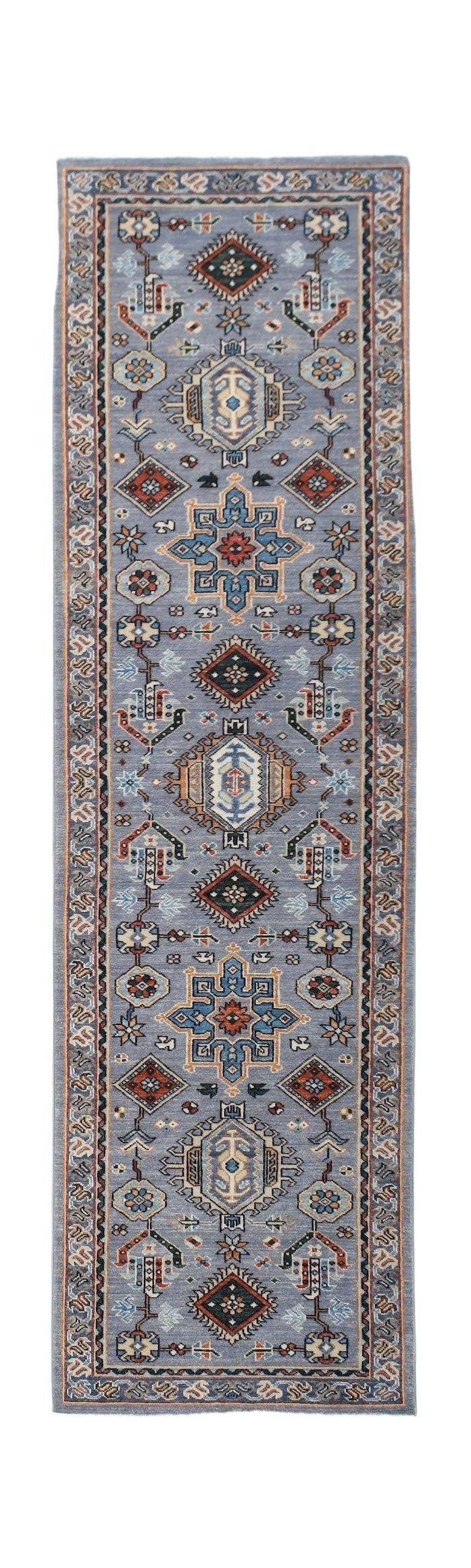 A hand-knotted Afghan Chobi runner featuring traditional geometric patterns in blue and earth tones.