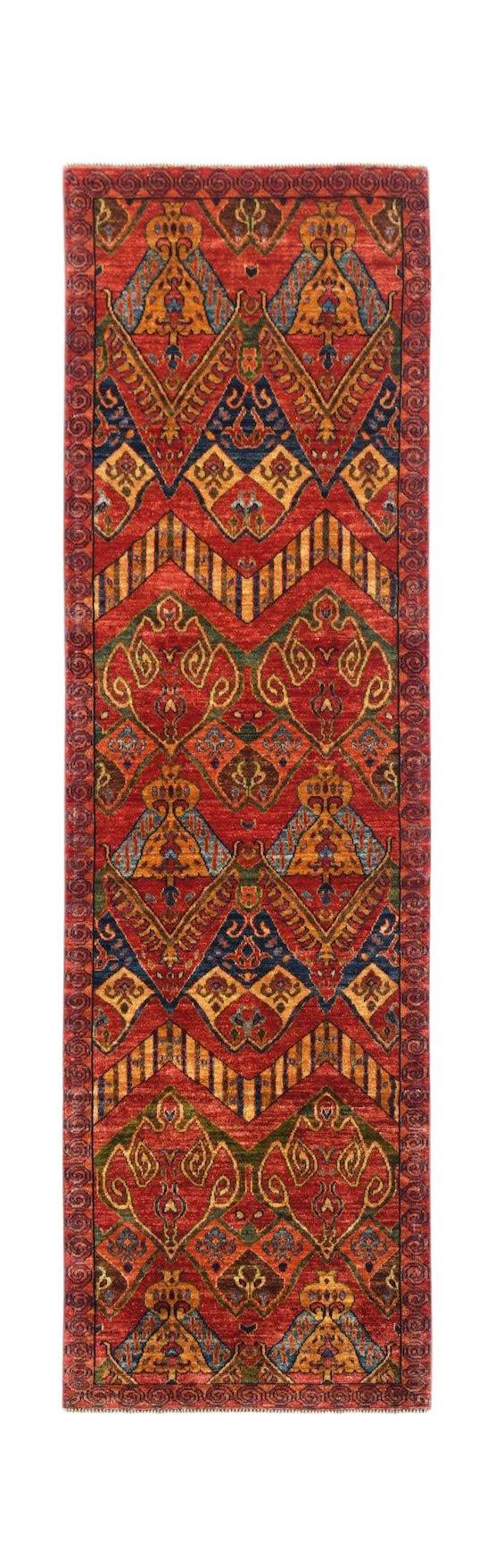 A handmade Afghan Chobi runner rug featuring traditional geometric patterns in red and blue tones.