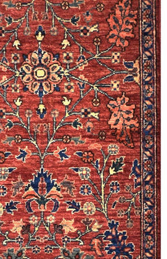 Handmade Afghan Chobi runner featuring a traditional floral pattern in red, blue, and cream tones.