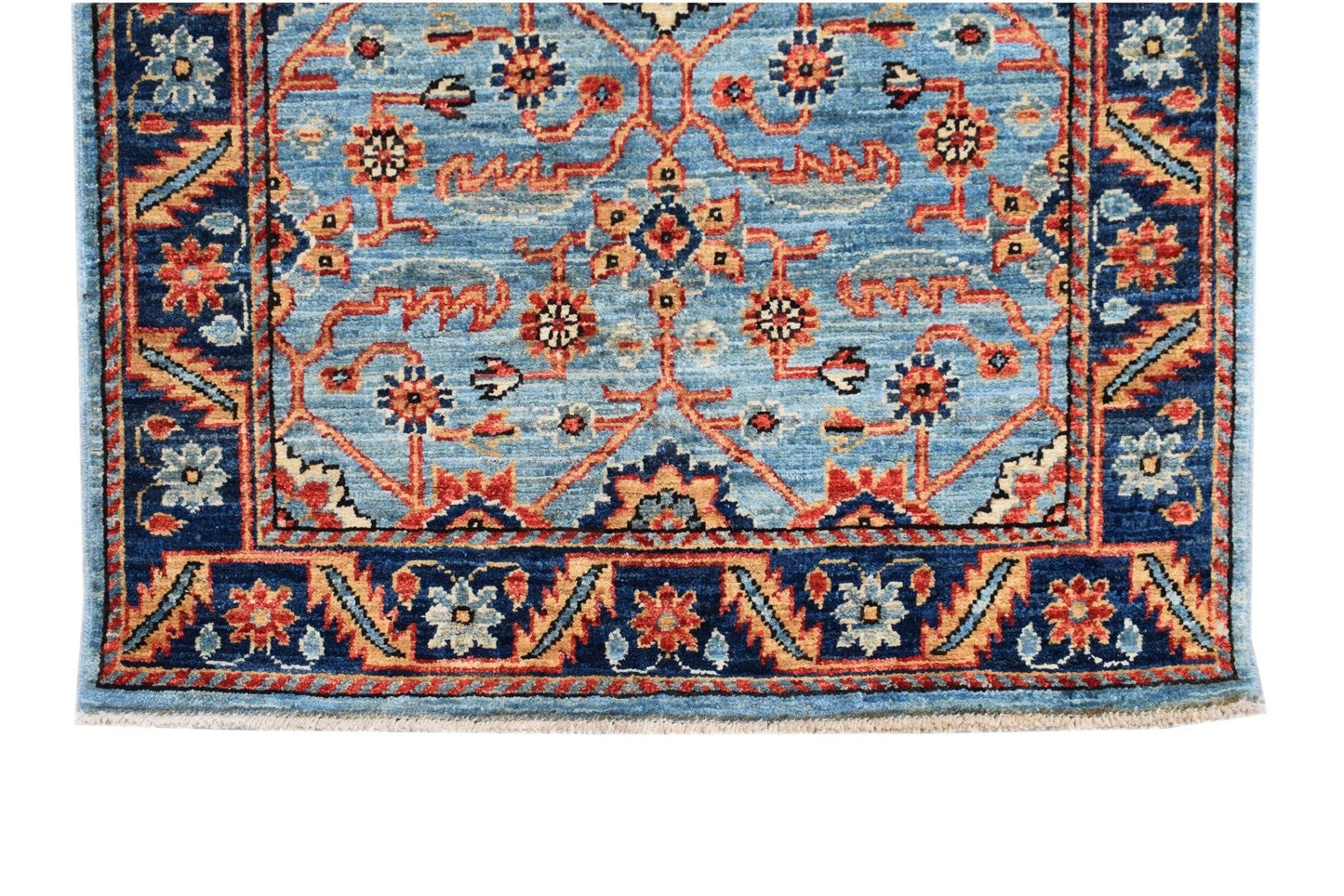 Handmade Afghan Chobi runner featuring a traditional floral pattern in blue, red, and tan tones.
