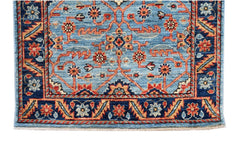 Handmade Afghan Chobi runner featuring a traditional floral pattern in blue, red, and tan tones.