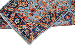 An Afghan Chobi runner featuring a traditional floral pattern in shades of blue, red, and tan.