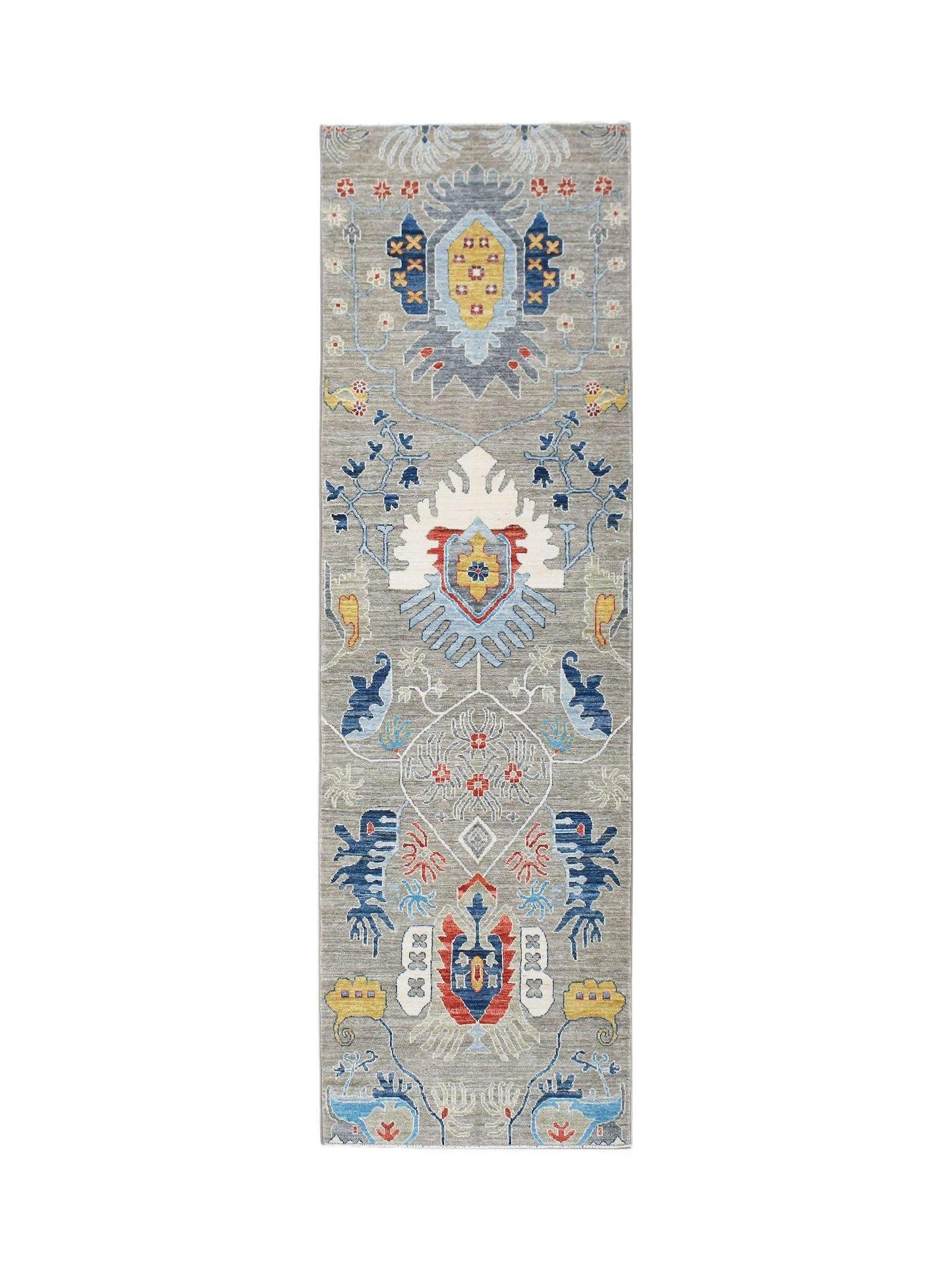 An Afghan Chobi runner rug featuring a traditional floral pattern in blue, red, and yellow tones.