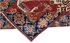 An Afghan Chobi runner featuring a traditional red and blue geometric pattern on handspun wool.