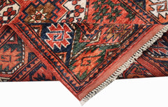 A handwoven Afghan Chobi runner featuring traditional geometric patterns in red, blue, and green.