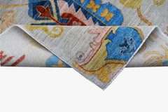 A handwoven Afghan Chobi runner featuring traditional floral patterns in blue, gold, and red.