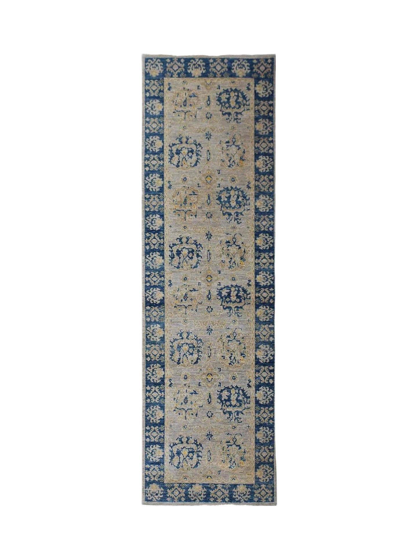 An Afghan Chobi runner rug featuring a blue border and a light grey field with floral motifs.