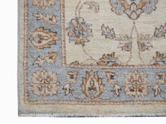 A handwoven Afghan Chobi runner featuring a traditional floral pattern in soft earth tones.