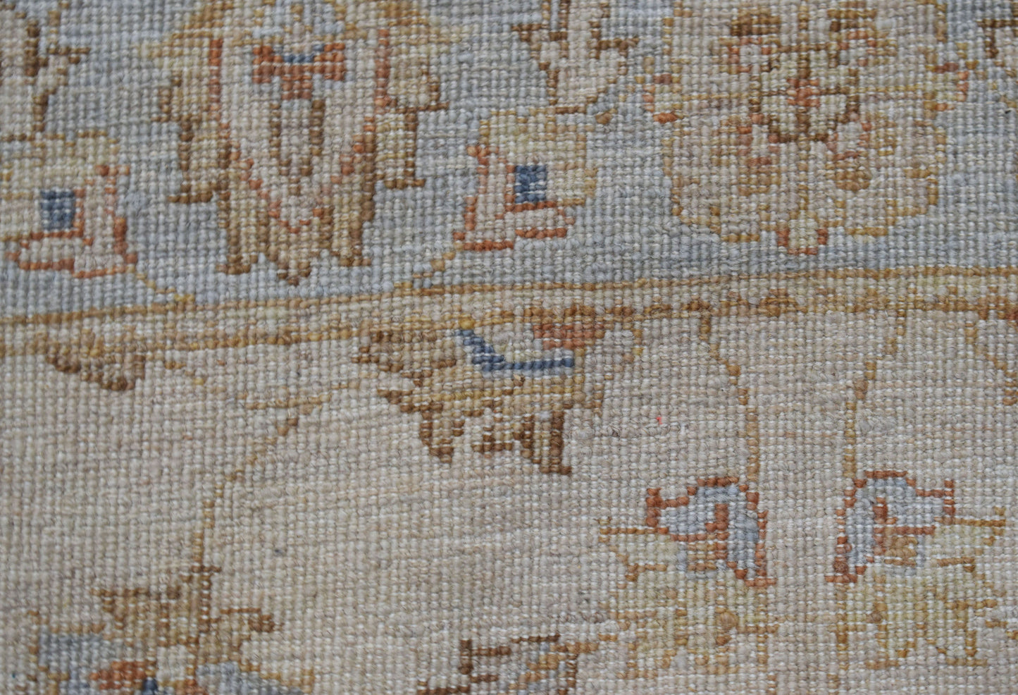 A close-up view of a handwoven Afghan Chobi runner featuring intricate traditional patterns.