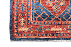 Handmade Afghan Chobi runner featuring a traditional geometric pattern in red and blue wool.