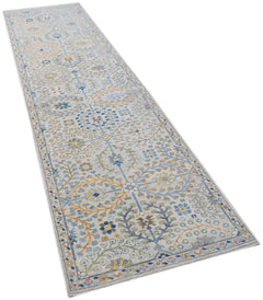 A long, hand-knotted Afghan Chobi runner featuring a traditional floral pattern in blue and gold.