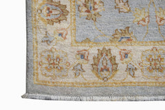 A handwoven Afghan Chobi runner featuring a light blue field with traditional floral patterns.