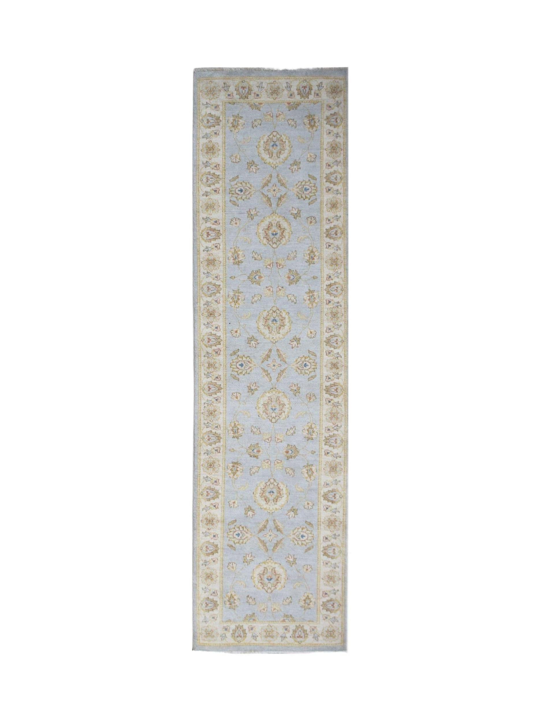 A handmade Afghan Chobi runner rug featuring a traditional floral pattern in soft blue and beige.