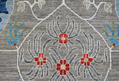 A handwoven Afghan Chobi runner featuring a grey field with red floral motifs and blue accents.