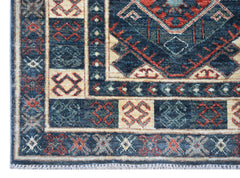 A handwoven Afghan Chobi runner featuring traditional geometric patterns in blue, red, and cream.