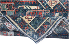 A handwoven Afghan Chobi runner featuring traditional geometric patterns in blue, red, and cream.