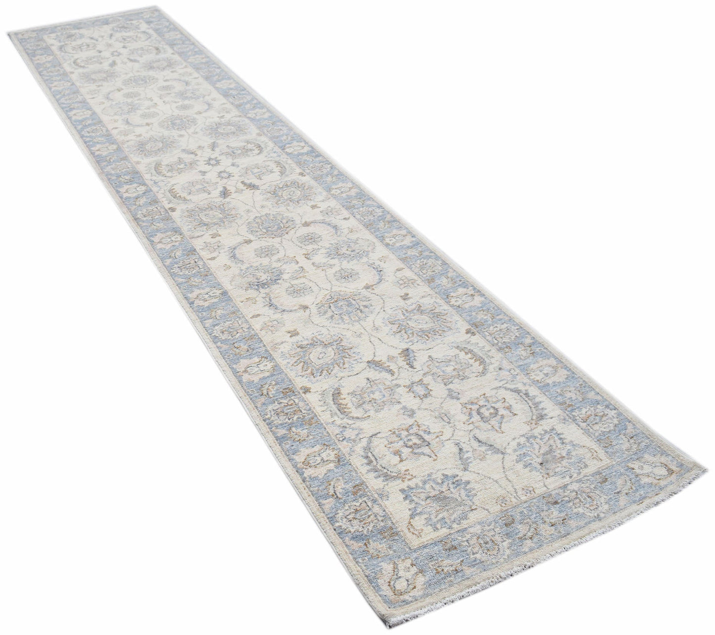 An Afghan Chobi runner rug featuring a traditional floral pattern in soft blue and cream tones.